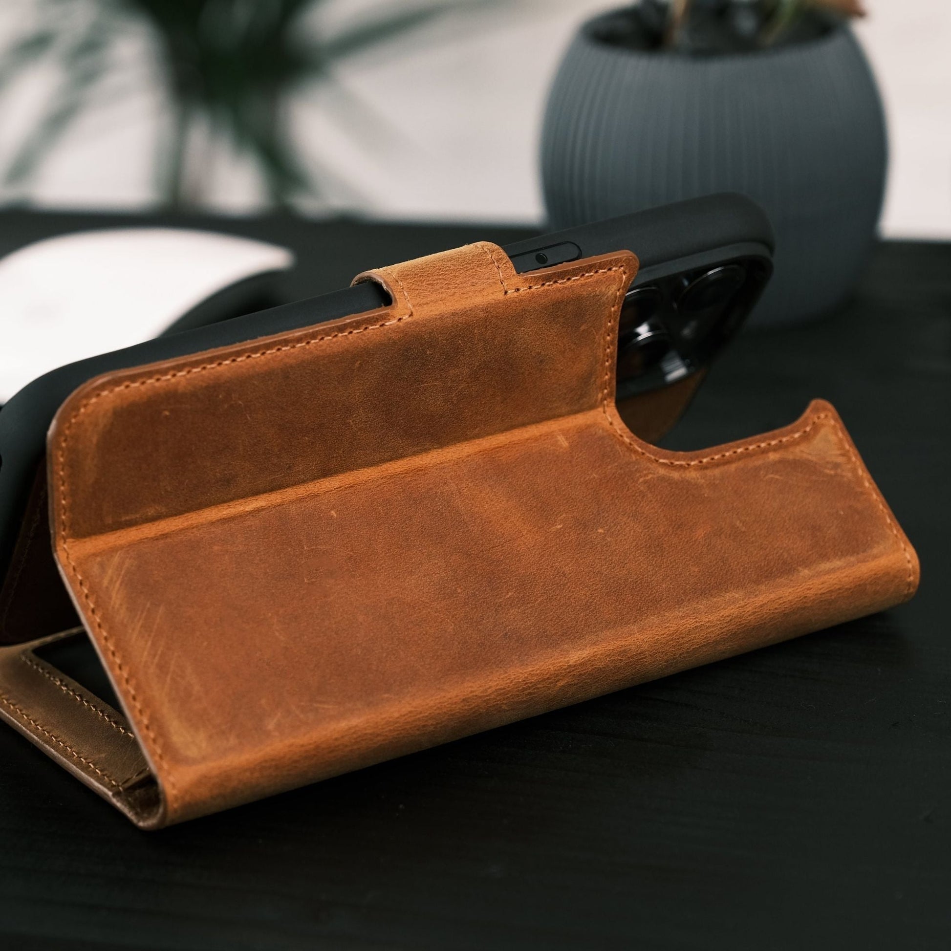 Toronata Casper Leather Wallet in various styles, compatible with iPhone 15 Series, featuring a magnetic detachable design, MagSafe compatibility, RFID protection, and a kickstand. Each variant showcases handcrafted genuine leather, multiple card slots, and a secure, functional design for sophisticated protection and style.