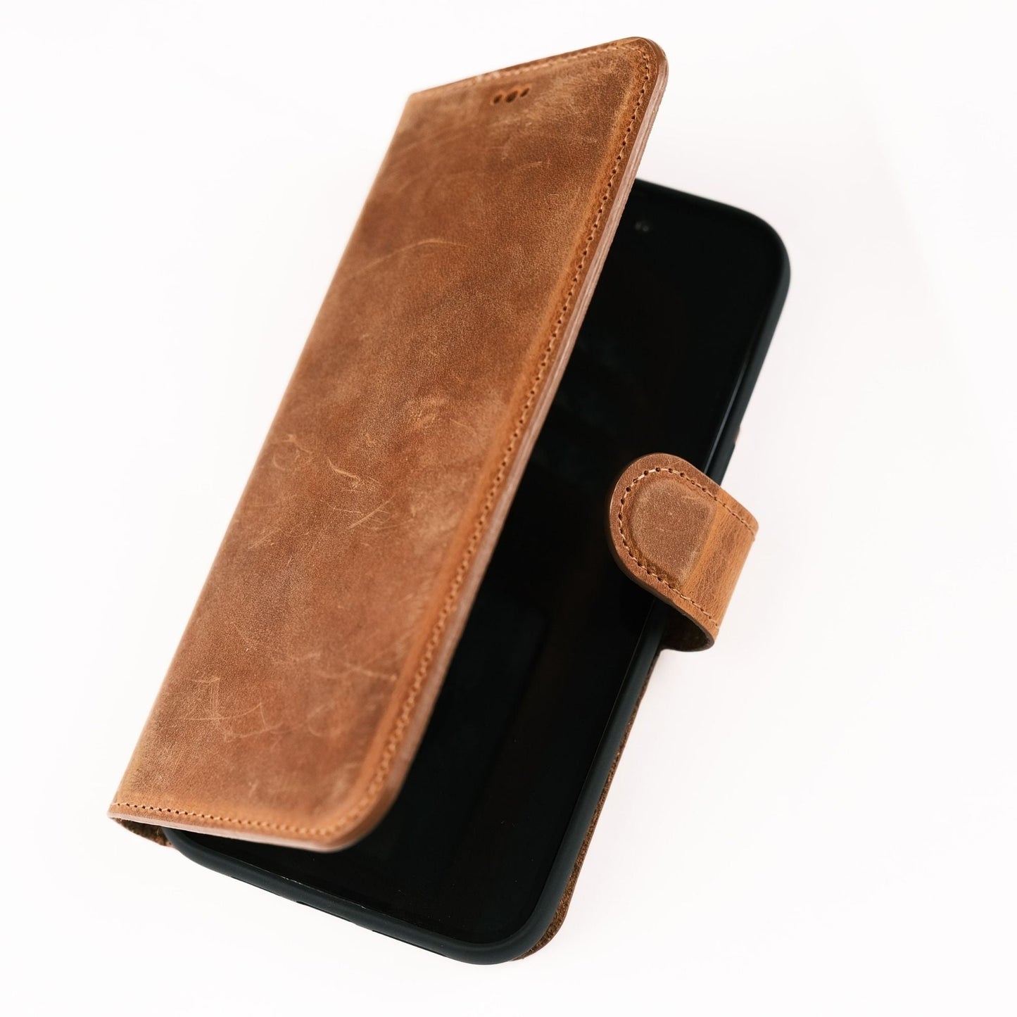 Toronata Casper Leather Wallet in various styles, compatible with iPhone 15 Series, featuring a magnetic detachable design, MagSafe compatibility, RFID protection, and a kickstand. Each variant showcases handcrafted genuine leather, multiple card slots, and a secure, functional design for sophisticated protection and style.